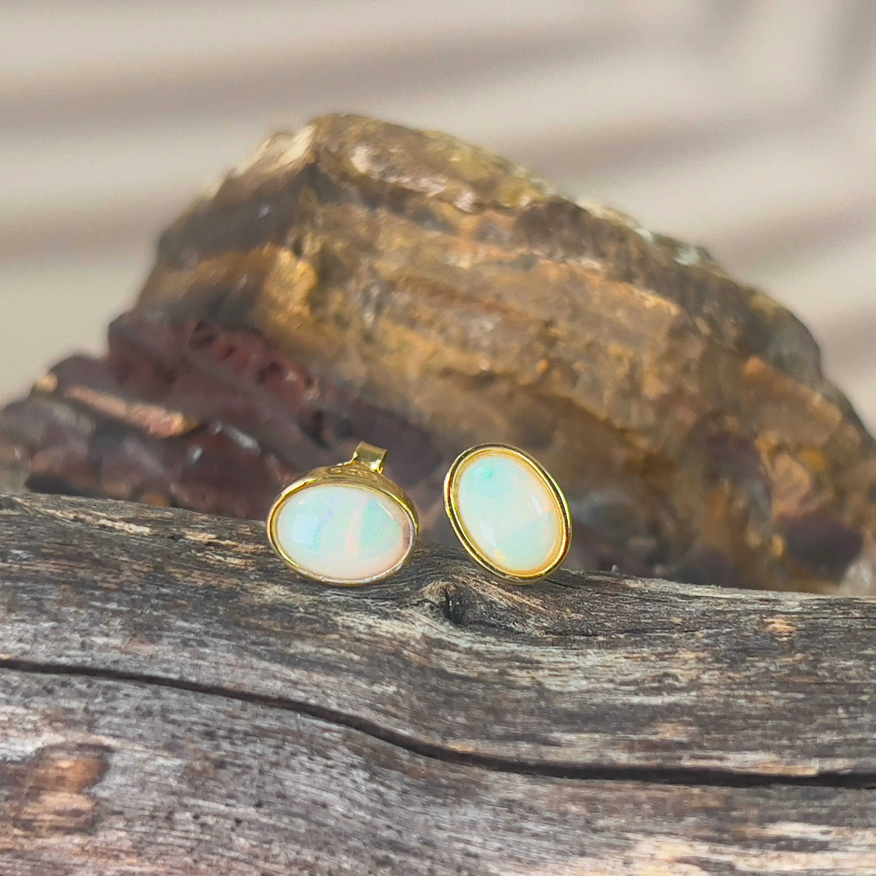 Gold plated sterling silver 7x5mm Light Opal bezel studs