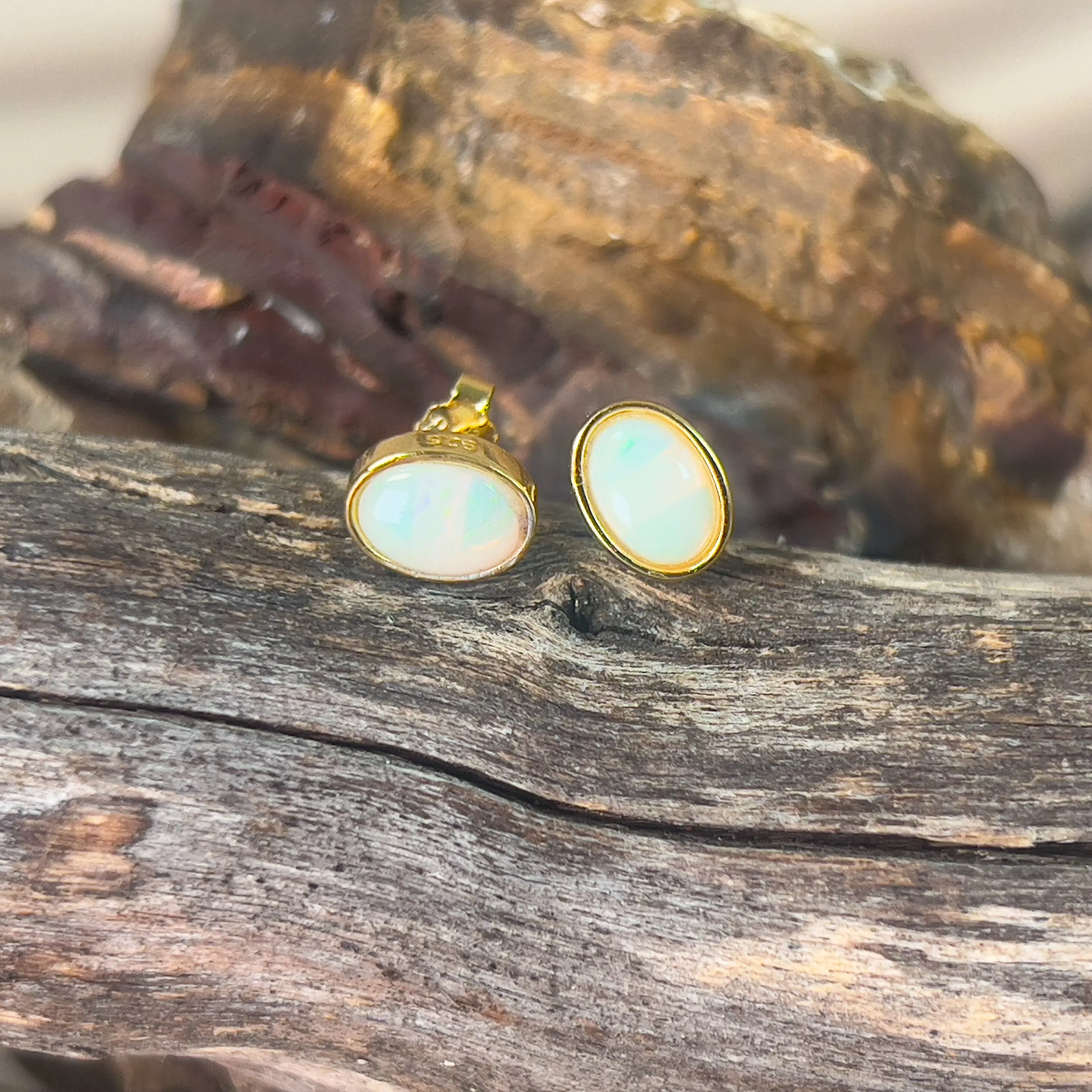 Gold plated sterling silver 7x5mm Light Opal bezel studs