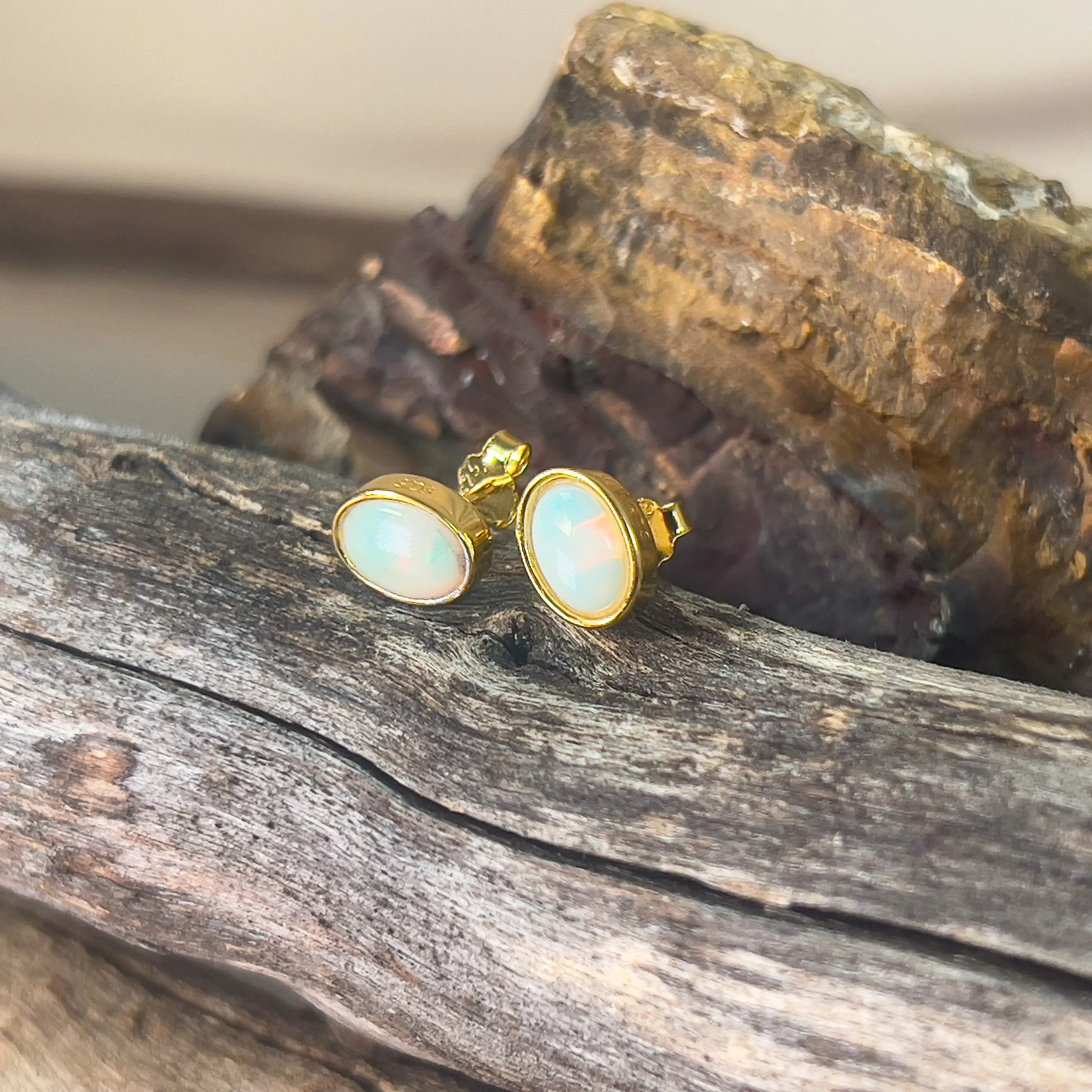 Gold plated sterling silver 7x5mm Light Opal bezel studs