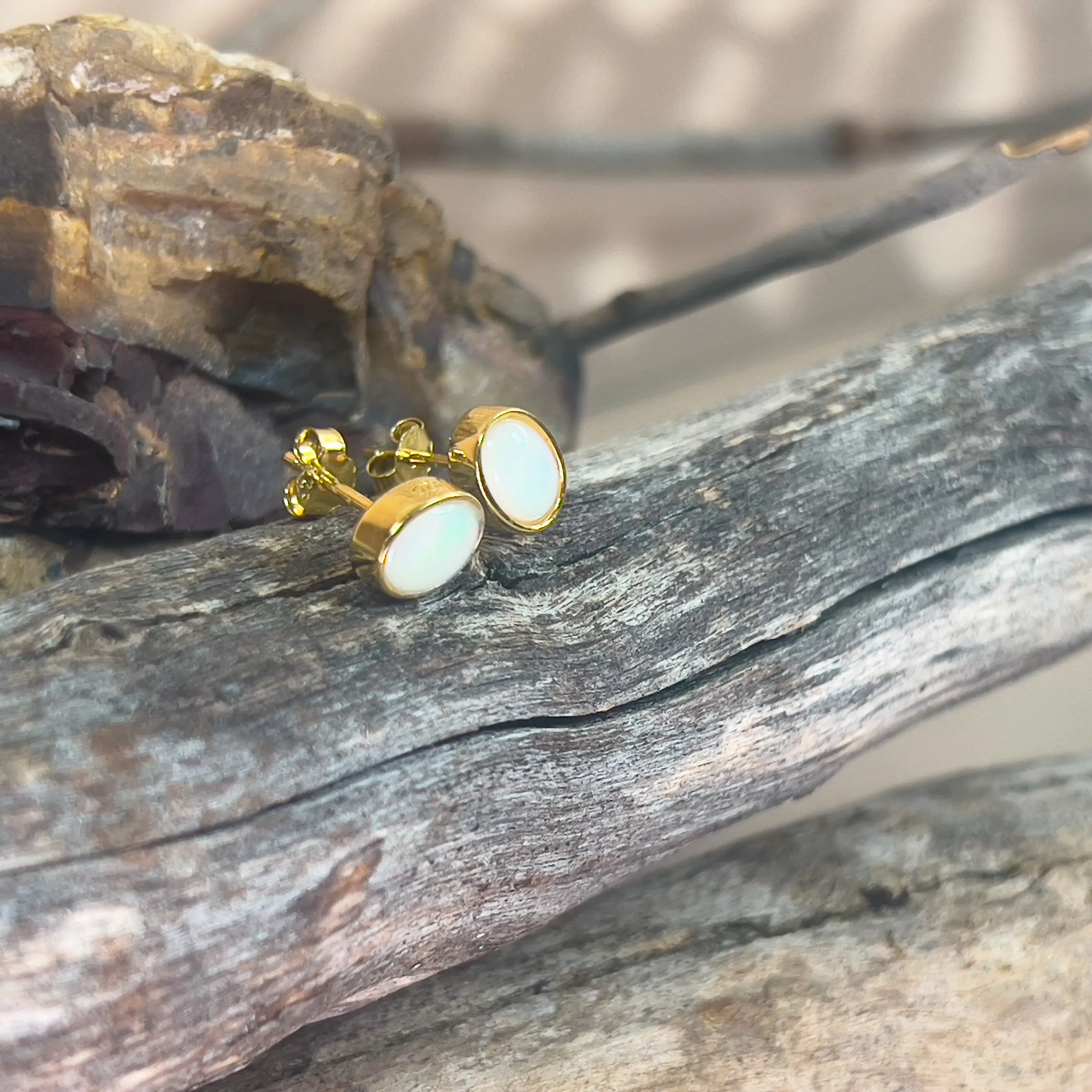 Gold plated sterling silver 7x5mm Light Opal bezel studs