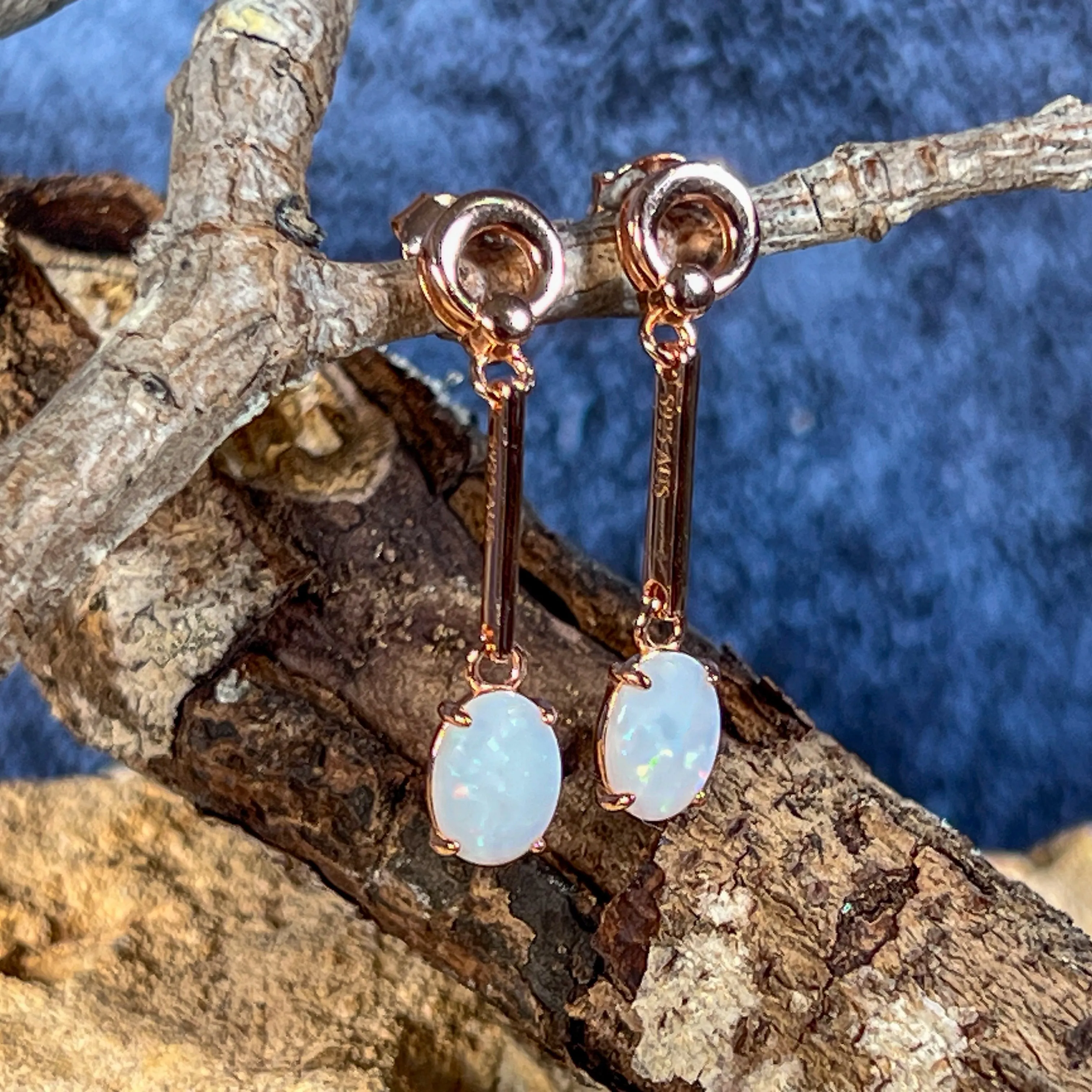 Rose Gold plated Silver dangling claw set White Opal earrings